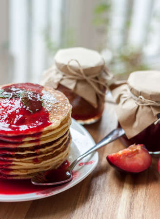 pancakes with plum jam delicious american breakfastの写真素材