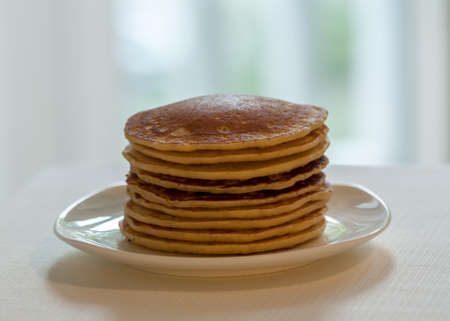homemade american pancakes breakfast on light blurred background