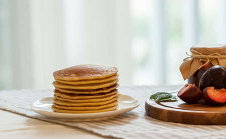 pancakes with plum jam delicious american breakfastの写真素材
