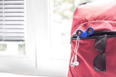red backpack with school suppliesの写真素材