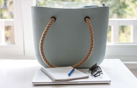 business woman set bue bag laptop and notebookの写真素材