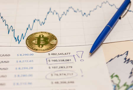 bitcoin ethereum litecoin coin pen and chartの写真素材