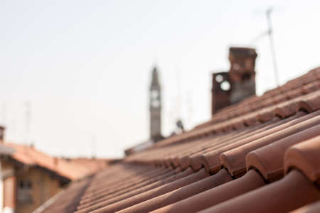 red tile roofs and tower of Italyan town Lomazzoの写真素材
