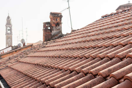 red tile roofs and tower of Italyan town Lomazzoの写真素材