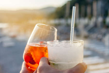 cheers two glasses with cocktailsの写真素材