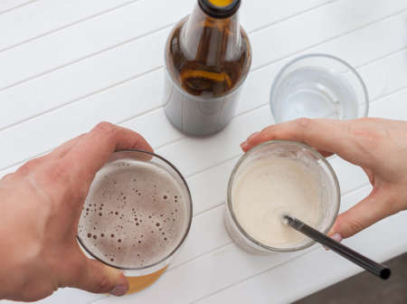 cheers glass and bottle of beerの写真素材