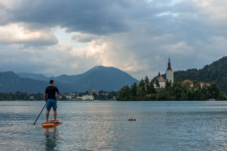 stand up paddle boarding on the lake Bled in Sloveniaの写真素材