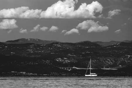 black white dramatic seascape Adriatic sea and lonely boat background