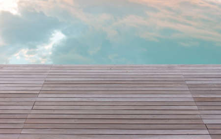 wooden platform and cloud reflection in poolの写真素材