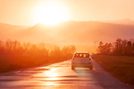 evening road heading to beautiful sunset horizonの写真素材