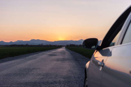 evening road heading to sunset view from car