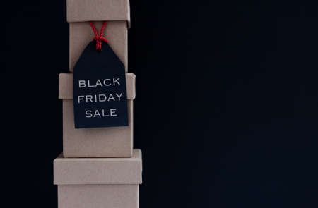 black friday sale tag on boxes dark background