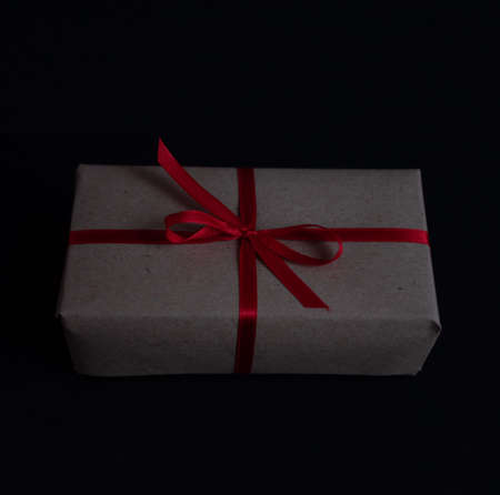 craft gift box with bow knot on dark background