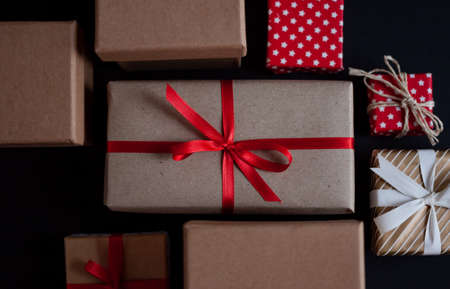 craft gift boxes with bow knots on dark background