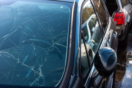 brocken blue car windshield damage after accident. Light reflection. Dangerousの写真素材