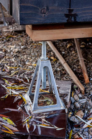 aluminium jack stands supporting painted wooden constructionの写真素材