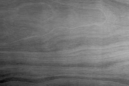 abstract wooden plywood black surface textured backgroundの写真素材