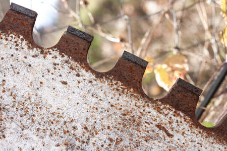 huge old rusty circular saw for granite silhouetteの写真素材