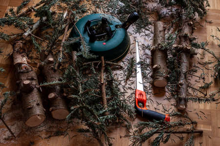 End of christmas season. Fir tree cut into dump pieces and logsの写真素材