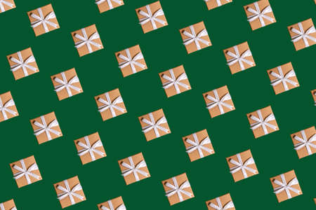 christmas pattern craft gift boxes on green backgroundの写真素材