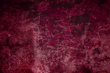 abstract scratched red painted textured surfaceの写真素材
