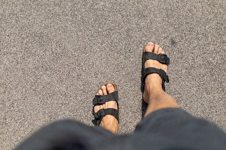 Male feet in slippers view from aboveの写真素材