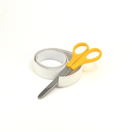 Elastic strips for cloth with scissor isolated on white backgroundの写真素材