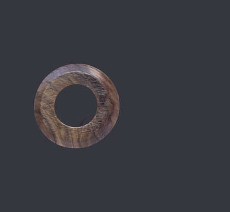 Top up view olive wooden napkin rings isolated on dark background. suitable for your design element.の写真素材