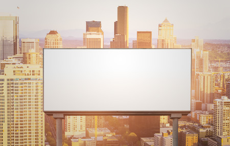 blank  white billboard for outdoor advertising  at sunset ,ready for product display montage,advertisement.の写真素材
