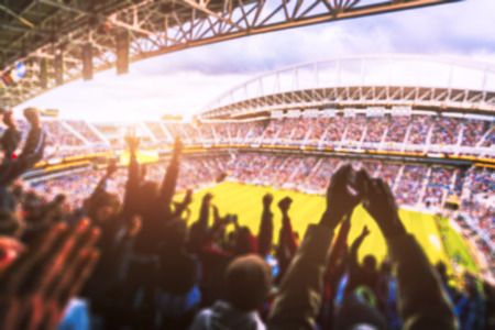 Football- Soccer,a lot of fans  in full stadium celebrate goal in  open air roof stadium in summer. -blurred technique.の写真素材