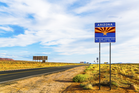 Arizona sign near by the road in entrance state area,Arizona,usa.の写真素材
