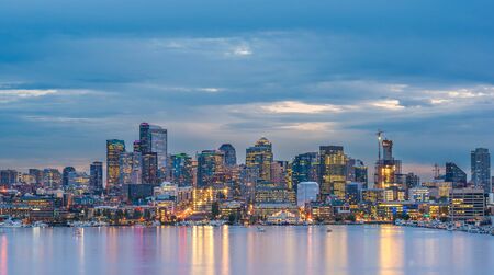 scenic view of Seattle cityscape in the night time with reflection of the water,Seattle,Washington,USA..の写真素材