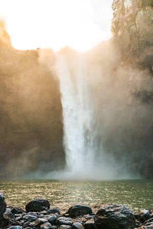 scenic view of Snoqualmie falls with golden fog when sunrise in winter season,Washington,USA..の写真素材