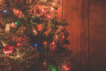 Christmas tree with many ornaments with led lighting bulb..
