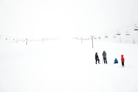 scenic view of small people around ski resort when snowy day..の写真素材
