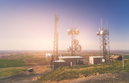 Telecommunication mast TV antennas on the sunny day.の写真素材