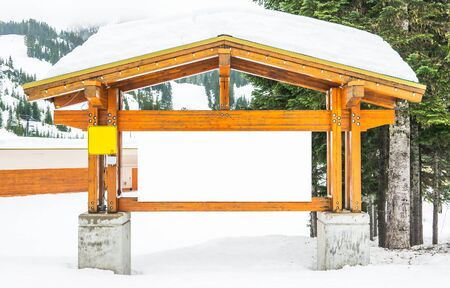 big Blank white billboard with snow covered Ready for product display montage advertisement.の写真素材