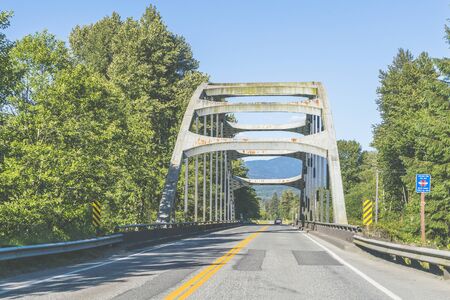 general steel bridge in country side in america.の写真素材