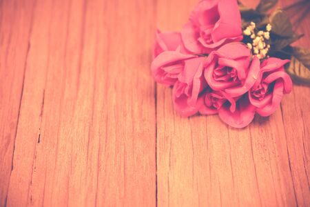 a bunch of rose on the wooden table top ,Ready for display montage,for valentine's day.の写真素材
