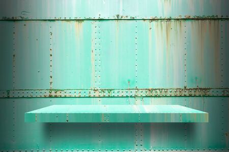 empty metal shelves top Ready for product display montage; metal shelves and green metal background.の写真素材