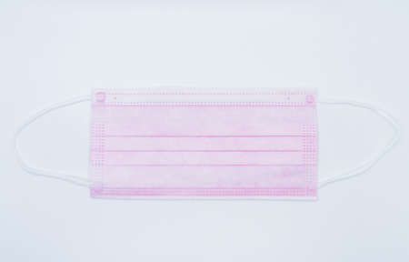 pink face masks isolated on white background.の写真素材