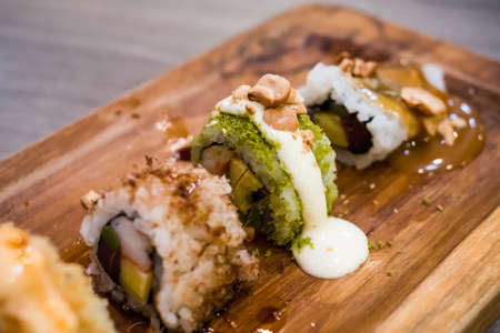 Sushi with lemon sauce top with nut, selective focus.の写真素材