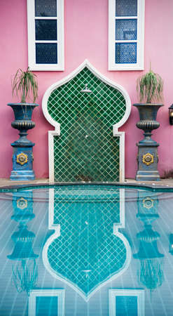 Pool with morocco style with purple wall and rockの写真素材