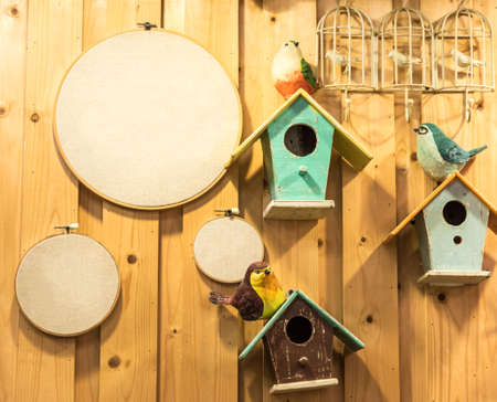 BIrd hosue and board with wood backgroundの写真素材