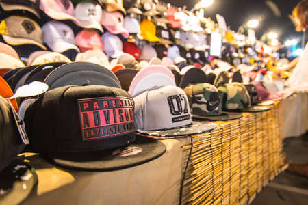 BANGKOK, THAILAND - APRIL 25, 2017: The cap for sale at night market.のeditorial素材