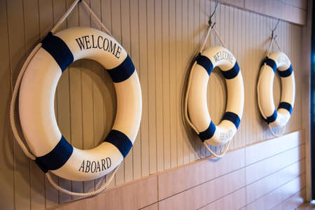 Life ring with Welcome aboard word decorate on wall