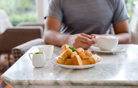 Dessert afternoon tea is a Thai tea sauce with small toast  and ice creamの写真素材