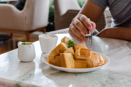 Dessert afternoon tea is a Thai tea sauce with small toast  and ice creamの写真素材