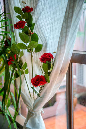decoration of rose and window with white curtainの写真素材