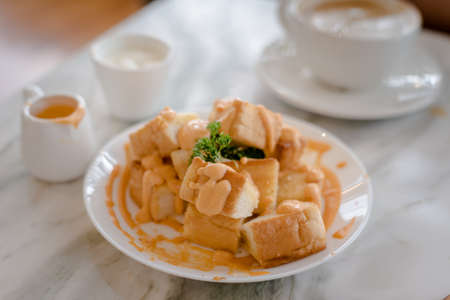 Dessert afternoon tea is a Thai tea sauce with small toast  and ice creamの写真素材